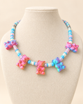 Gummy Bear Necklace, Cotton Candy, by CATE: five faceted gummy bears in pink, blue, and rainbow between sky blue, pearl, and lilac beads.